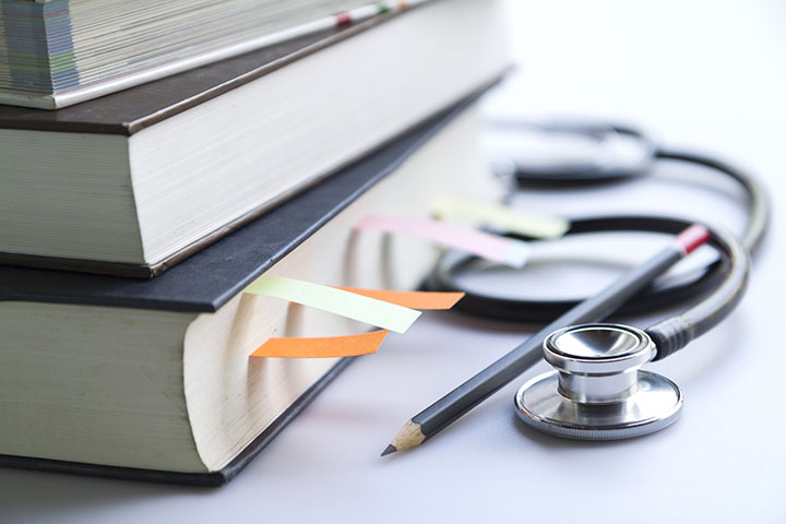 Stack of medical student textbooks Residency Curriculum scaled 1