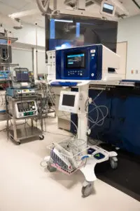 Medical equipment in a hospital room at Phoebe, including heartbeat monitors, wires, and a ventilator on wheels.